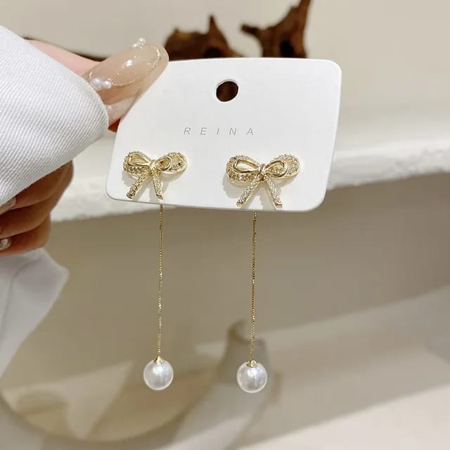 Yu Fashions Bow Shaped Crystal Drop Pearl High Fashion Korean Earrings Pair