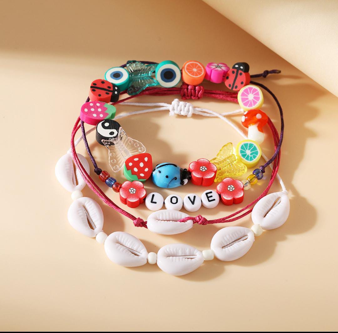 Yu Fashions 4 Layered White Shell LOVE letter flower Bug Multilayered Korean Bracelet