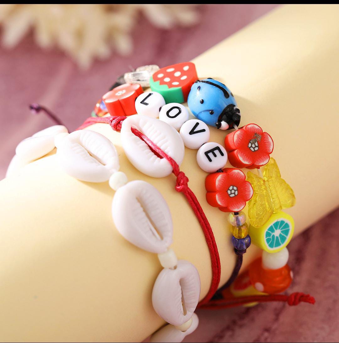 Yu Fashions 4 Layered White Shell LOVE letter flower Bug Multilayered Korean Bracelet