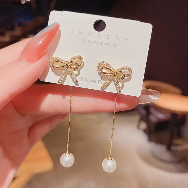 Yu Fashions Bow Shaped Crystal Drop Pearl High Fashion Korean Earrings Pair